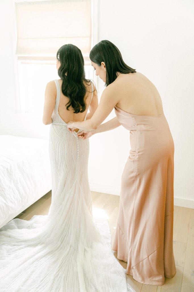 Bride getting ready with maid of honor