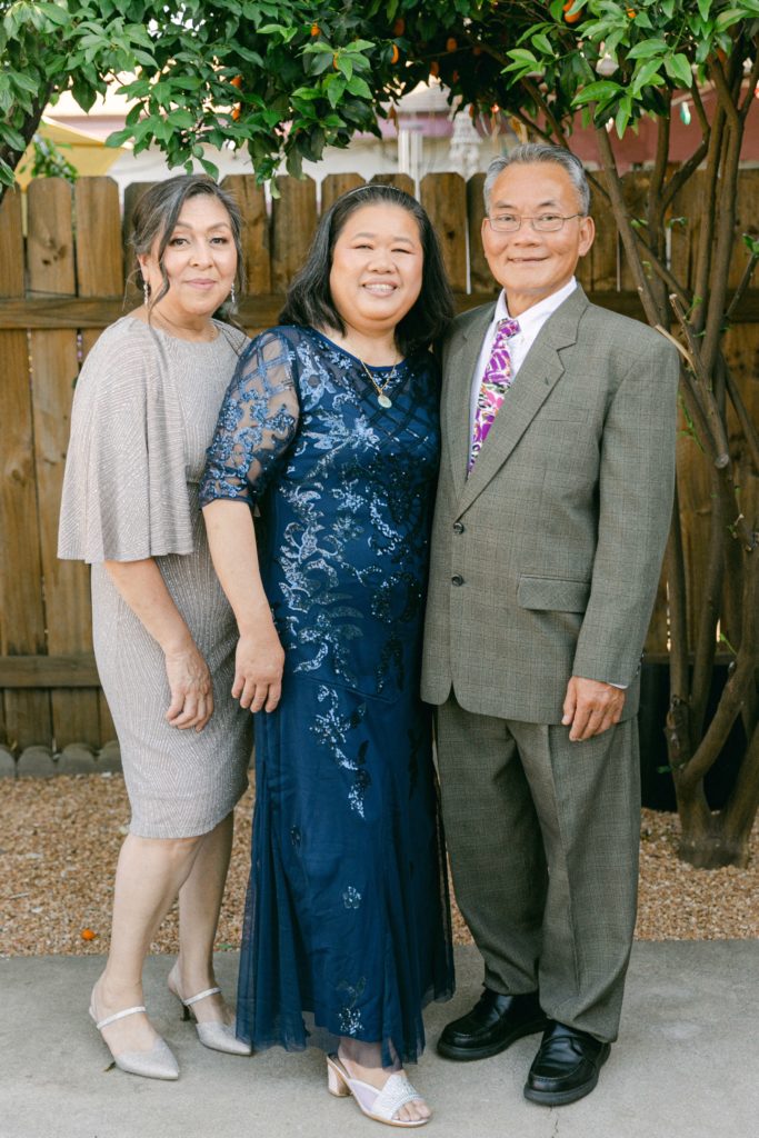Mother of the bride and mother and father of the groom portrait